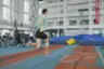 Complex sequence of movements in a pole vault including run-up, planting, take-off and bar clearance