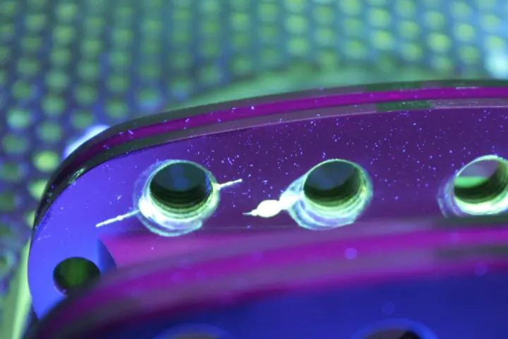 In dye penetrant testing, a special fluid is applied to the material's surface; thanks to its good ability to penetrate voids, it seeps into any cracks that are present. 