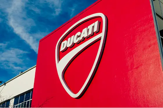 Ducati logo at the company’s headquarters in Bologna The iconic Ducati logo on the façade of the company’s headquarters in Borgo Panigale, Bologna.