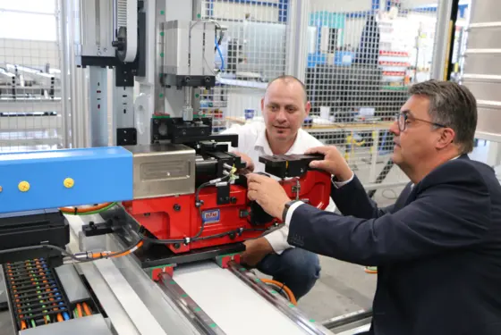 Hans-Werner Fisch (right), CEO of BTM Europe, and Christian Sitte (left), Head of Sales DACH JSB (Joining System Business) at Kistler, inspect the clinching system.